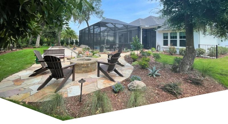 a patio with a fireplace and a covered pool